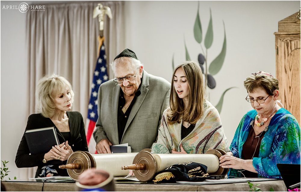 Jewish Girl Reads from the Torah at her Bat Mitzvah with Grandparents by her side