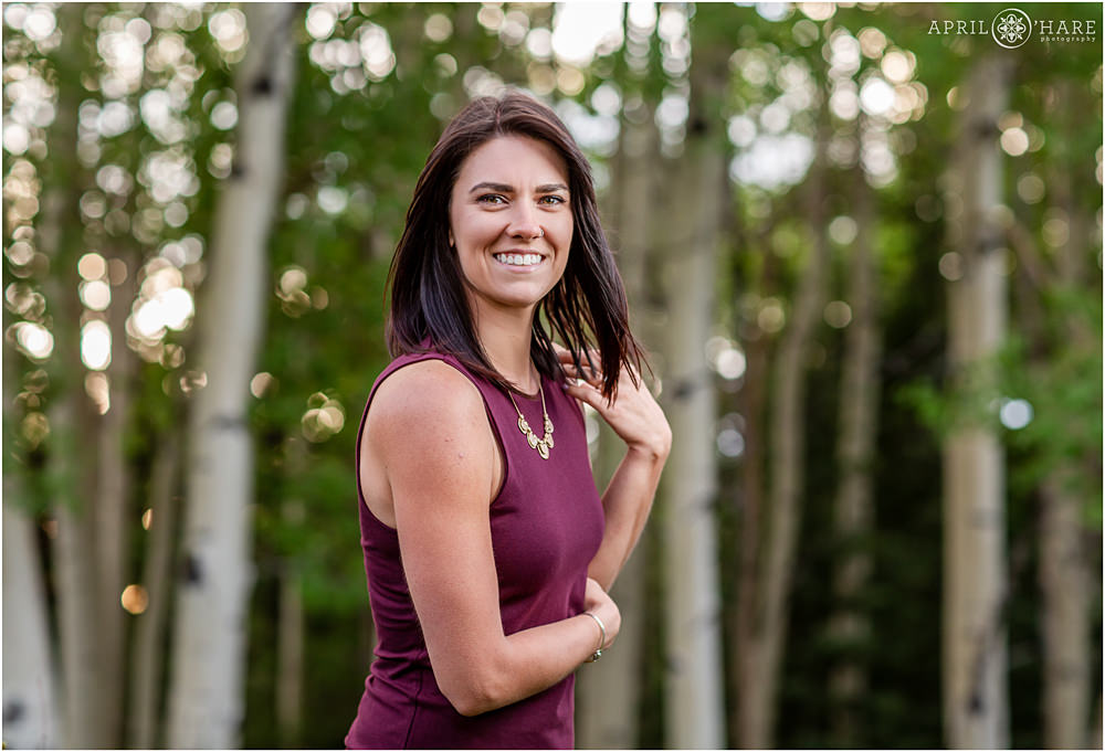 Gorgeous bokeh at a Colorado personal branding photography session in an aspen tree grove in Evergreen