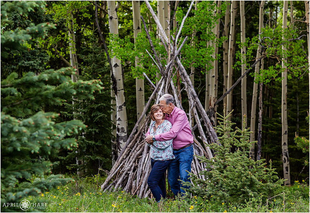 Wood Tipi backdrop in an Aspen Forest in Evergreen Colorado Family Photo
