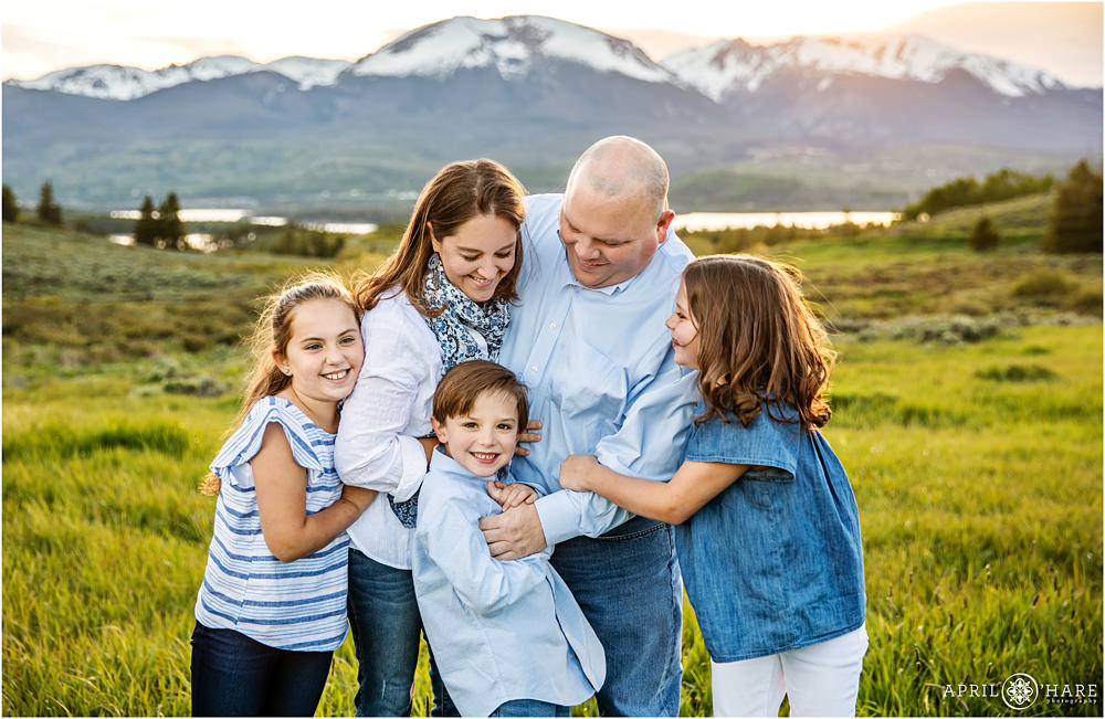 Pretty sunset family portraits at Lake Dillon with Mountain Backdrop in Colorado