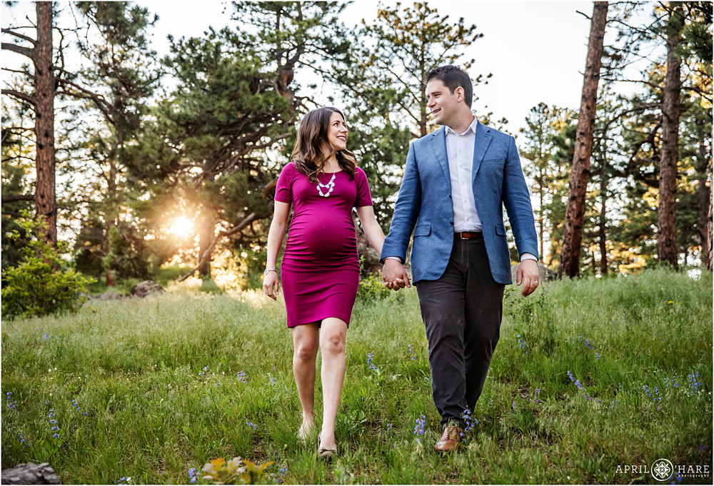 Wildflowers and backlit sunset maternity photos at Mount Falcon in Evergreen Colorado