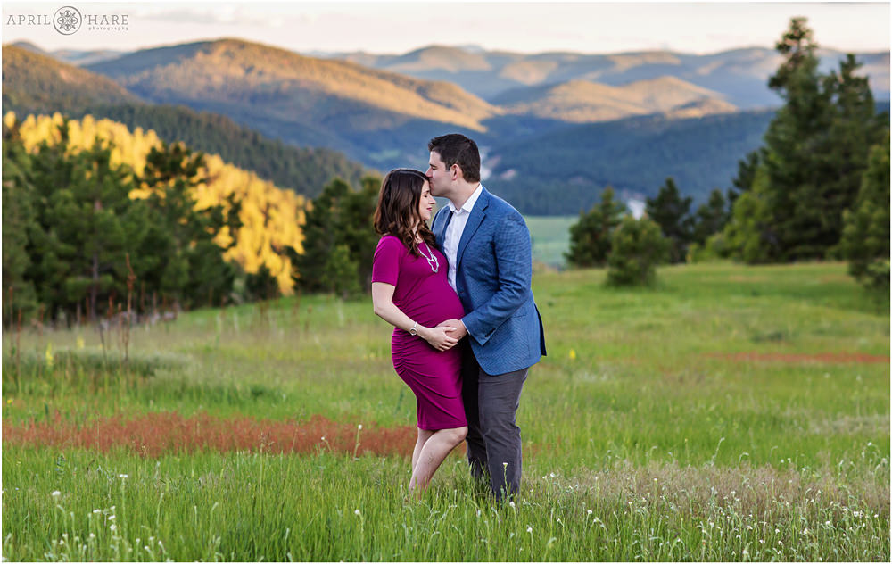 Romantic Mountain Maternity Photos in a field of wildflowers at Mount Falcon in Evergreen