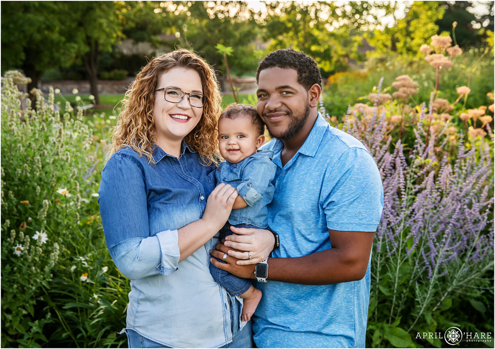 Sweet photo of a baby boy with his parents at a Littleton Extended Family Photo Session at Hudson Gardens