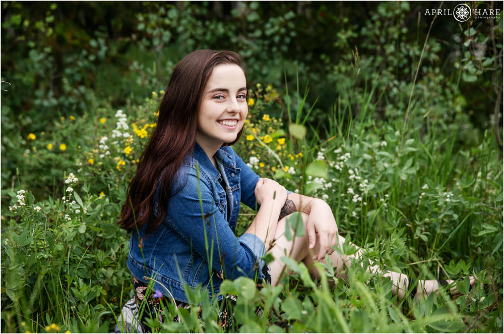 Evergreen Senior Photography in a mountain meadow with wildflowers