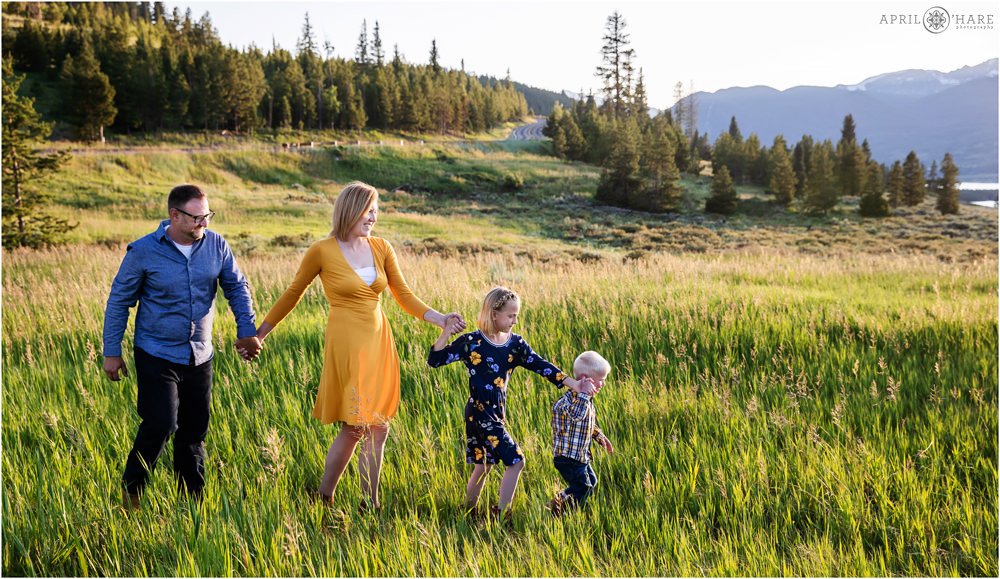 Lake Dillon Family Photography walking through a mountain meadow in Colorado