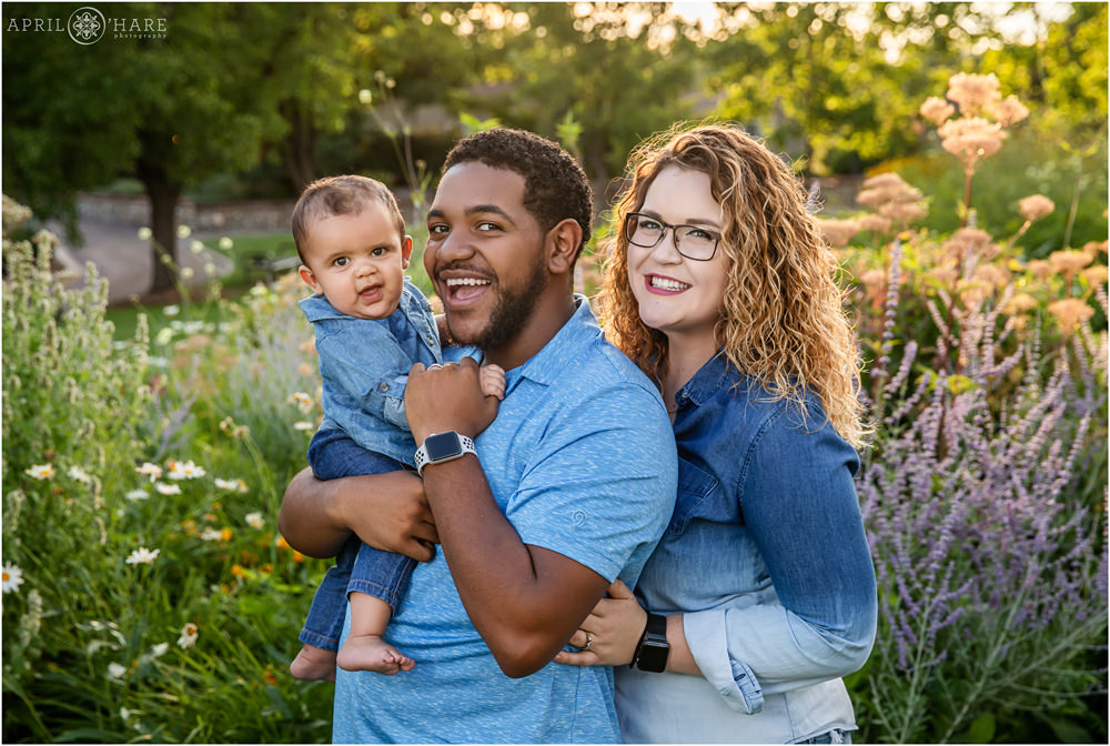 Adorable biracial family with smiling baby boy at their Littleton Extended Family Photo Session in Colorado
