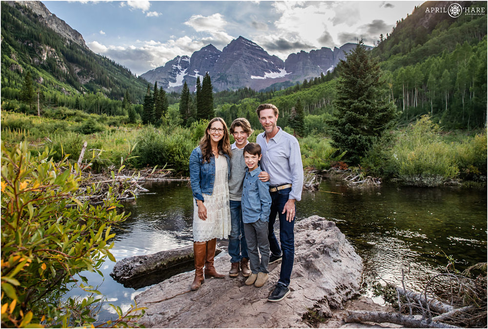 Pretty Summer Family Photos next to West Maroon Creek at Maroon Bells in Aspen
