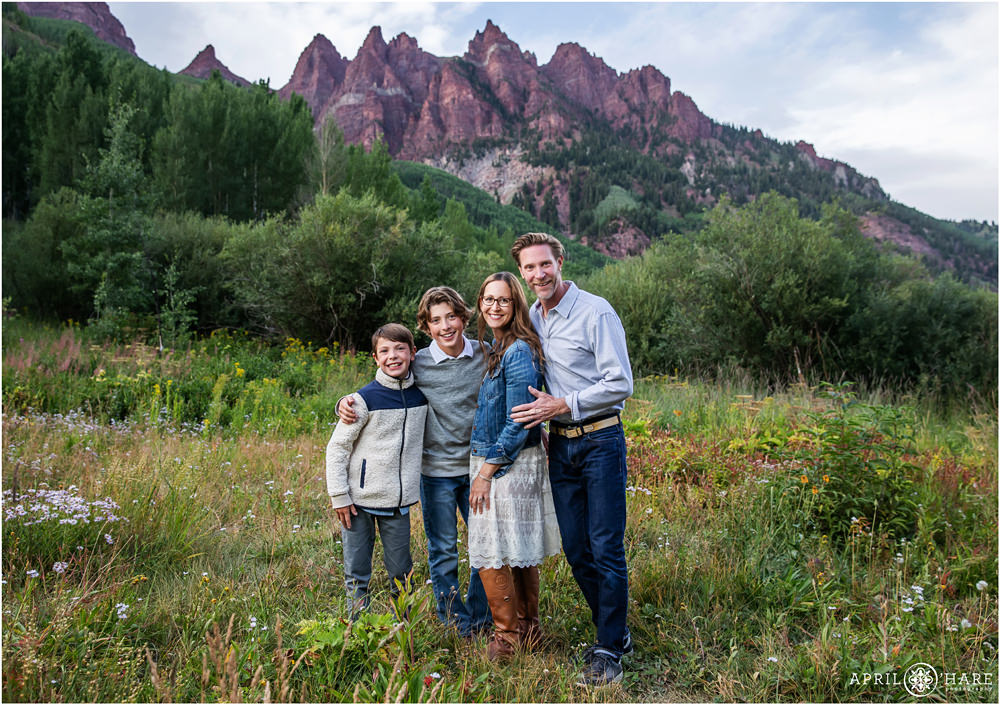 Aspen Snowmass Family Photography Session with Wildflowers and Sievers Mountain South in the backdrop
