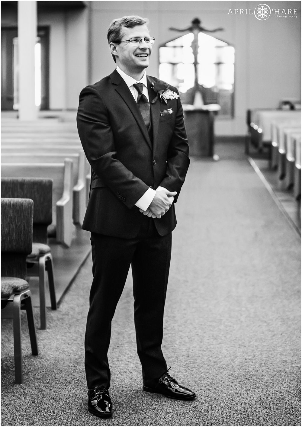 Groom waits for the first look at Our Father Lutheran Church in Centennial Colorado