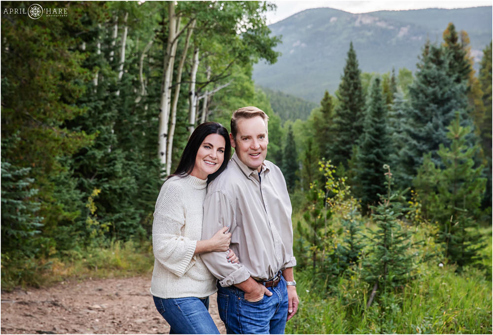 Mom and dad get a couples portrait on a pretty Colorado mountain path in Evergreen