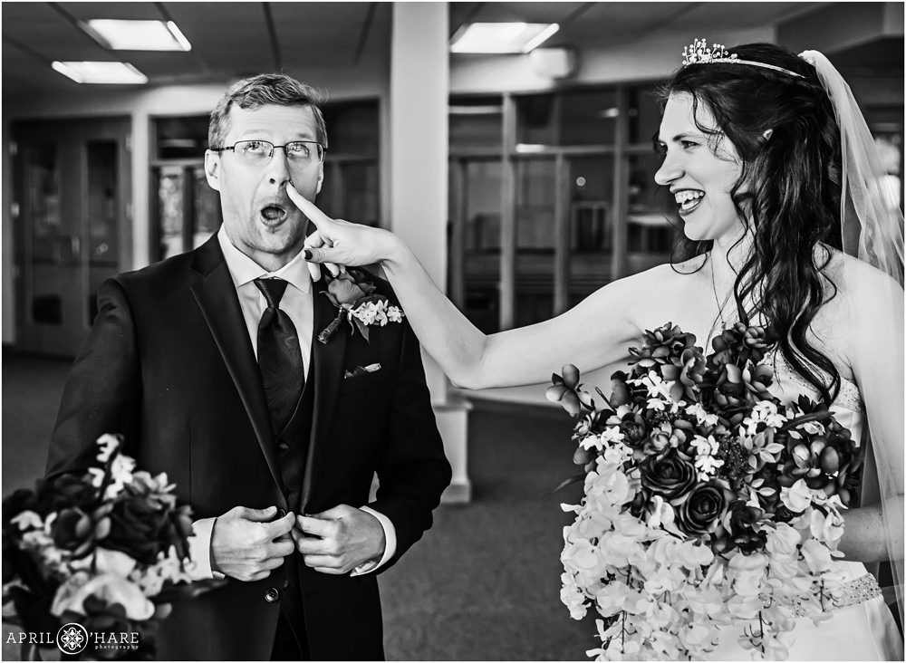 Silly B&W Photo of Bride touching her groom's nose at Our Father Lutheran Church