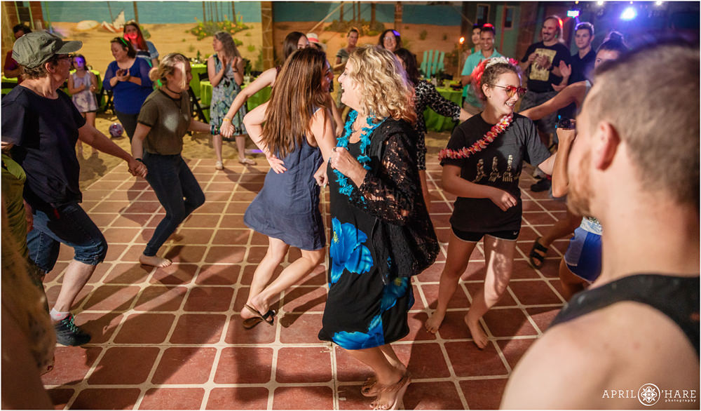 Guests dancing at a beach themed bar mitzvah party at The island in Aurora Colorado