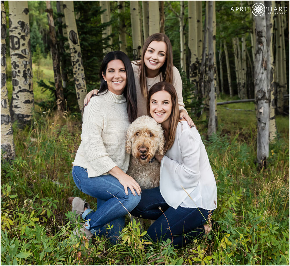 Cute photo of the ladies of the family with their dog in Evergreen Colorado
