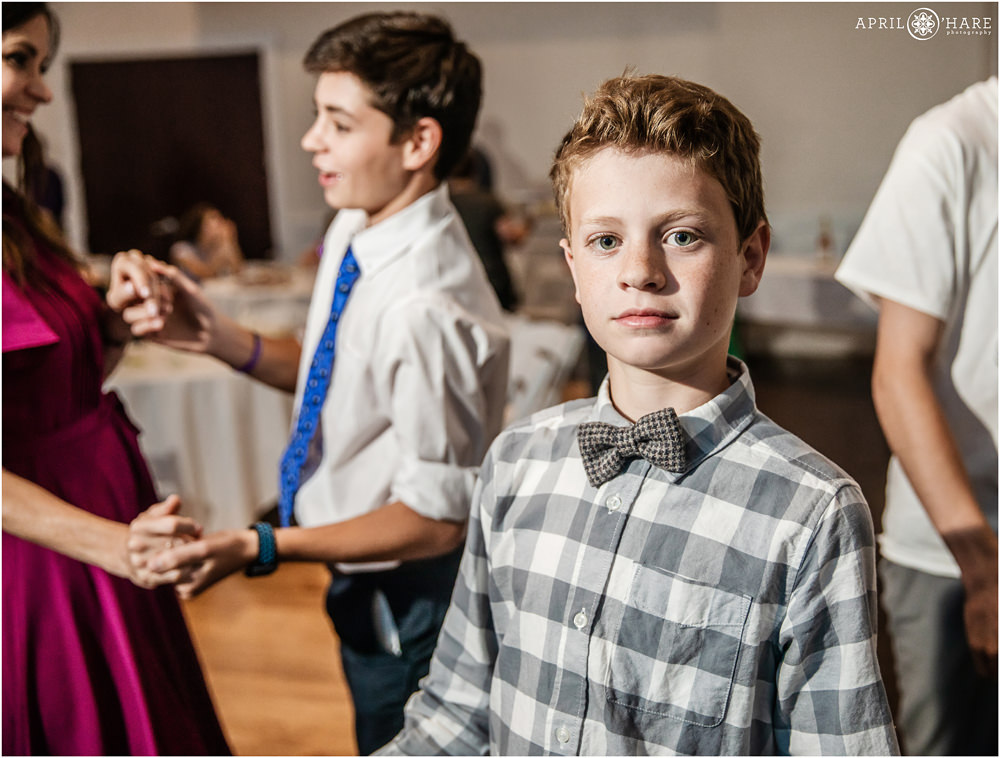 Kid wearing a bowtie on the dancefloor at Ashley Ridge Wedgewood Weddings