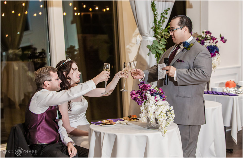 Best man gives a toast and clinks champagne flutes at his friend's Ashley Ridge Wedding Reception