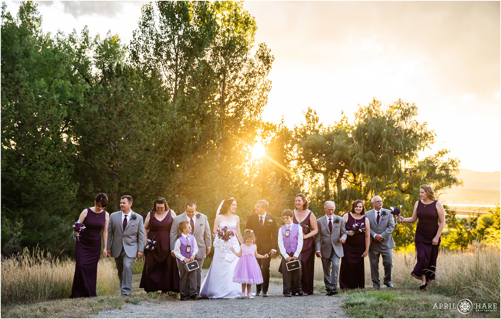 Pretty Backlit Wedding Party Photo at Flyin' B Park in Highlands Ranch Colorado
