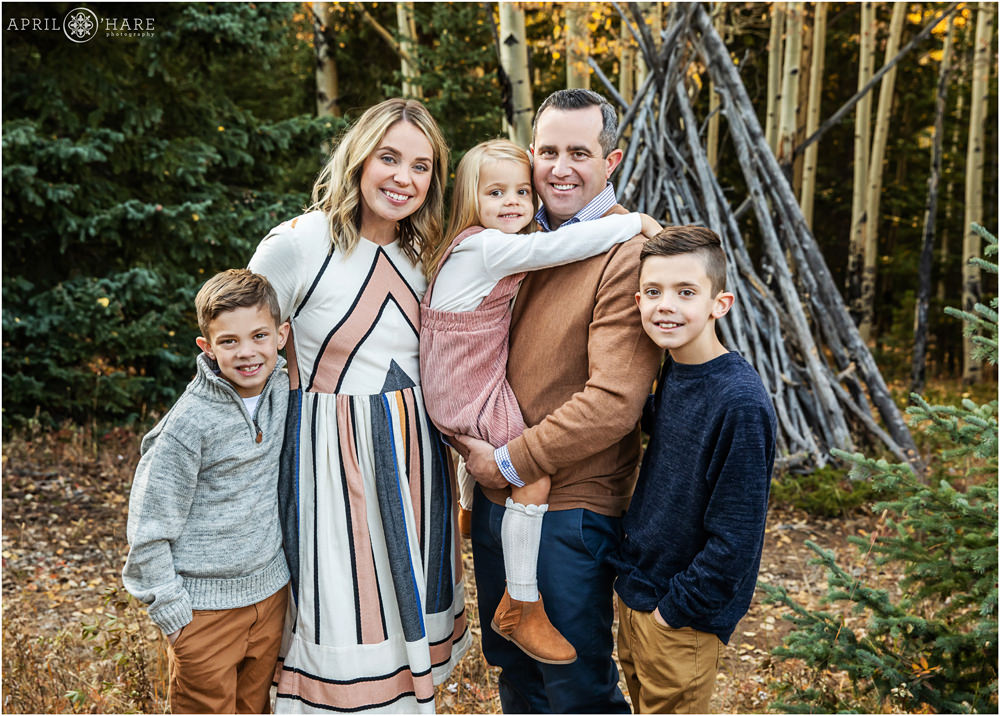 Cute family photo during autumn in a mountain forest environment in Evergreen Colorado