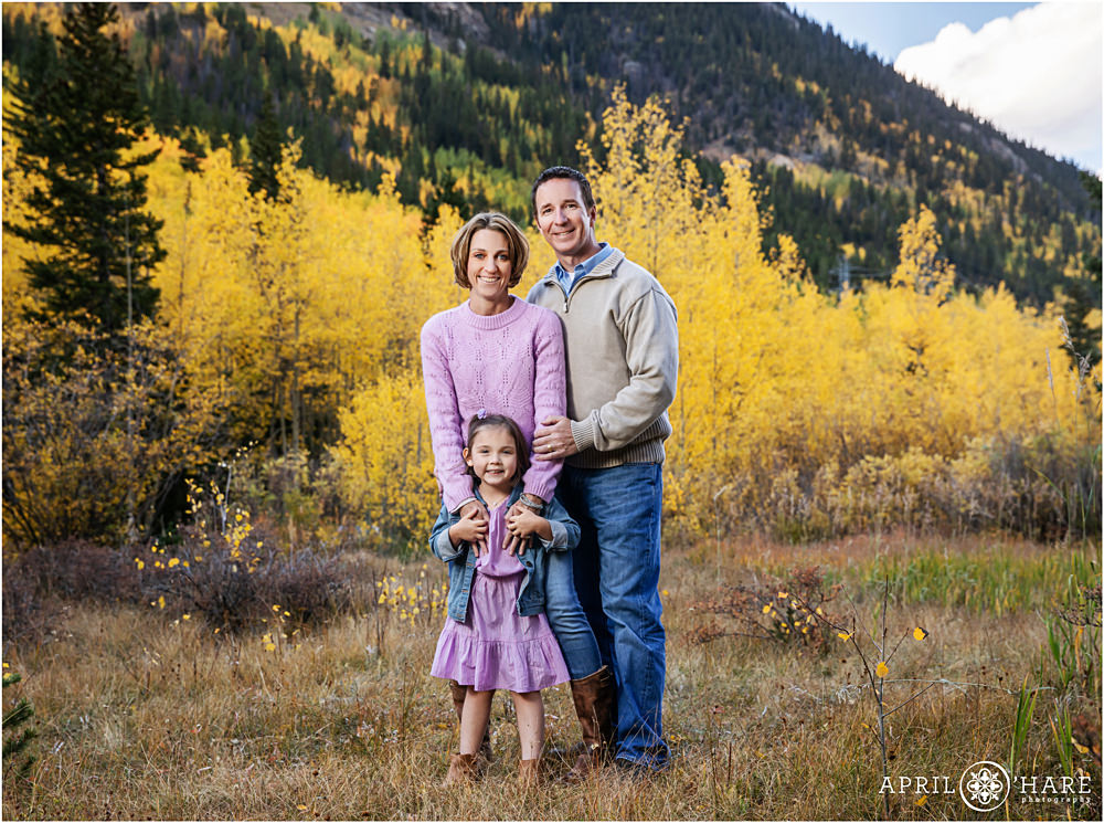 Gorgeous mountain backdrop with pretty yellow aspens family photos on Guanella Pass in Colorado
