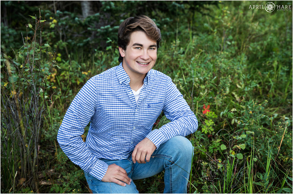 High school senior photo in a mountain meadow in Evergreen Colorado