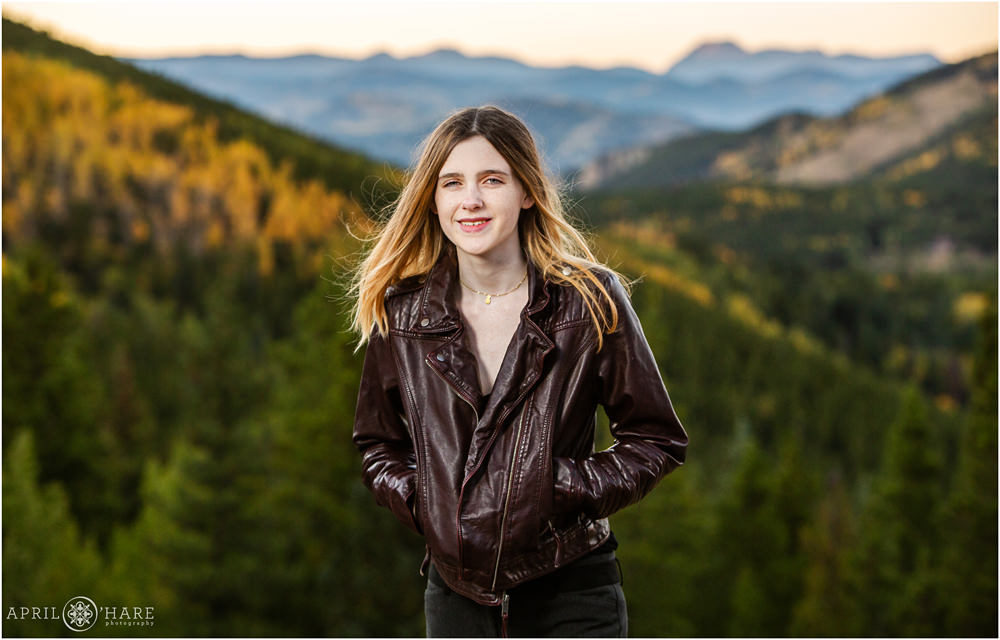 Casual high school senior portrait with mountain backdrop on Squaw Pass Road in Evergreen Colorado