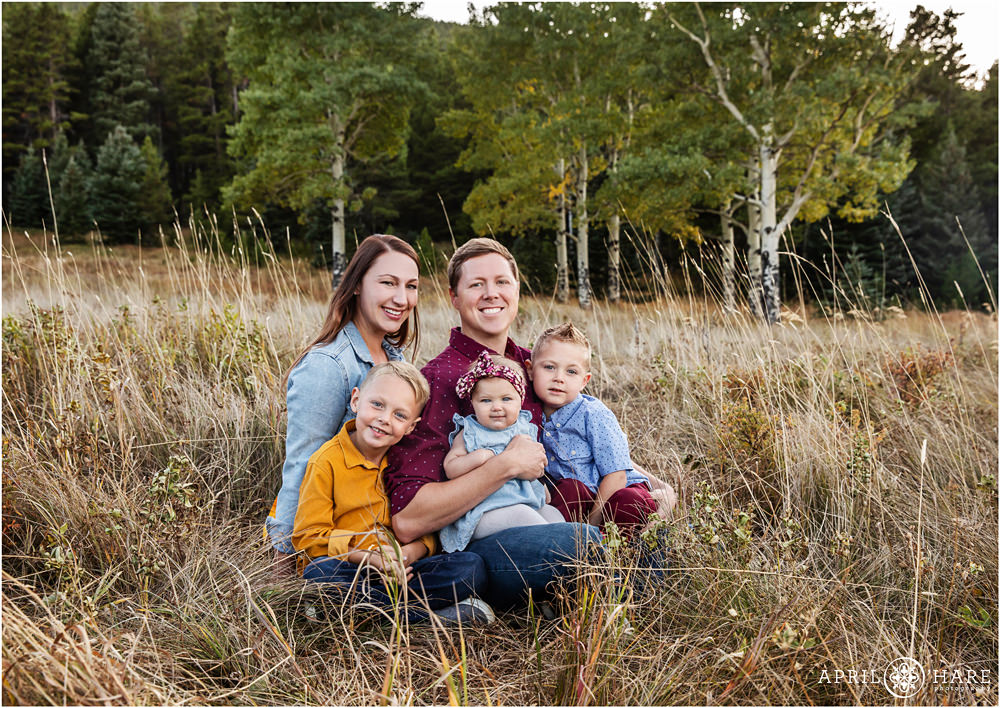 Evergreen Family Photographer in a Mountain Field with Aspen Tree Backdrop