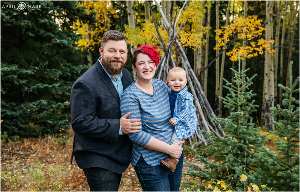 Beautiful fall color family photography with baby boy wearing blue in Colorado