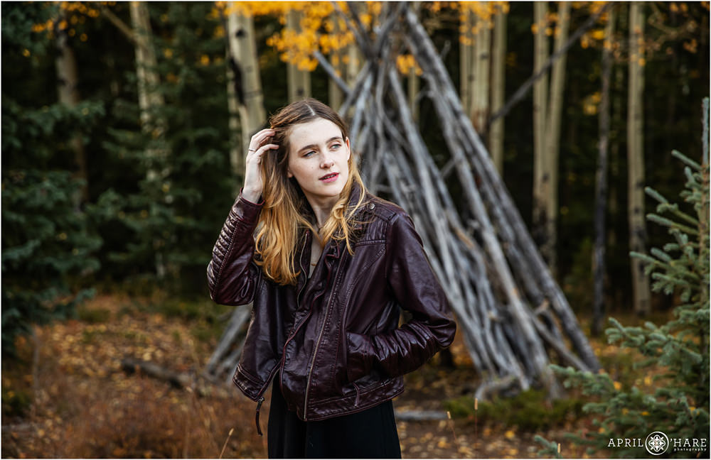 Beautiful moody high school senior portrait on a fall color day in the Colorado mountains