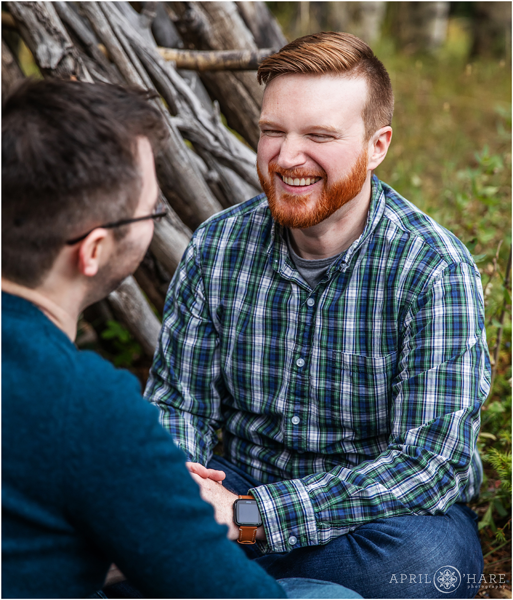 Happy moment of laughter during Colorado engagement photography session in the mountains