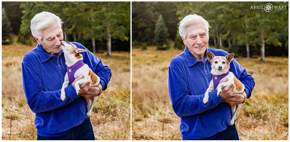 An older man gets doggie kisses at his family photography session in a pretty fall color mountain meadow in Colorado