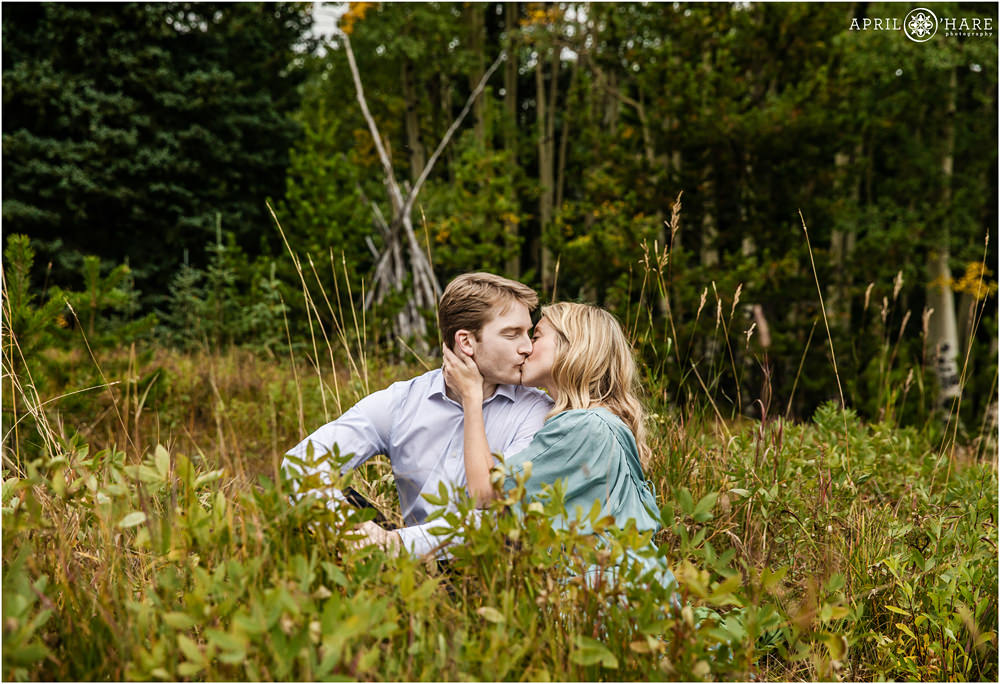 Romantic Colorado Engagement Photography in a pretty wooded mountain meadow