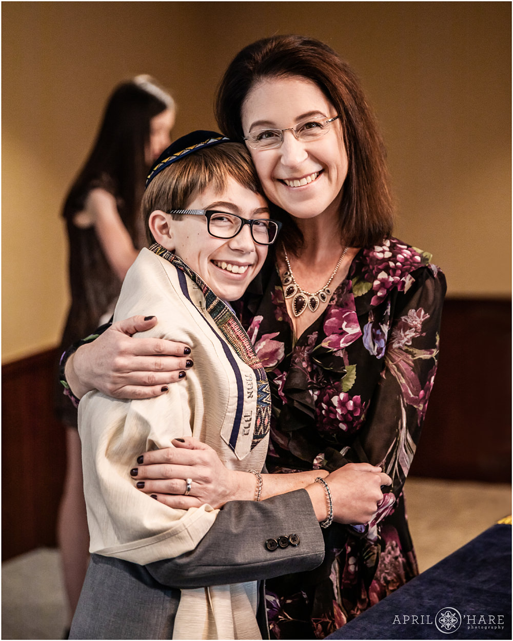 Mom hugs her son on the day of his bar mitzvah in Fort Collins Colorado
