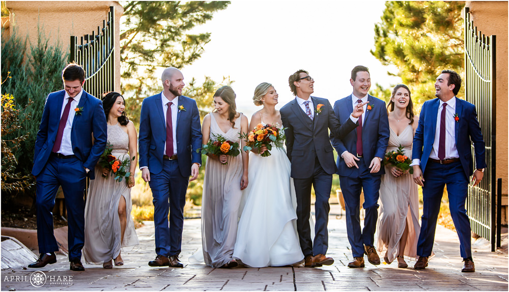 Wedding party laughs together for a candid portrait at Villa Parker in Colorado