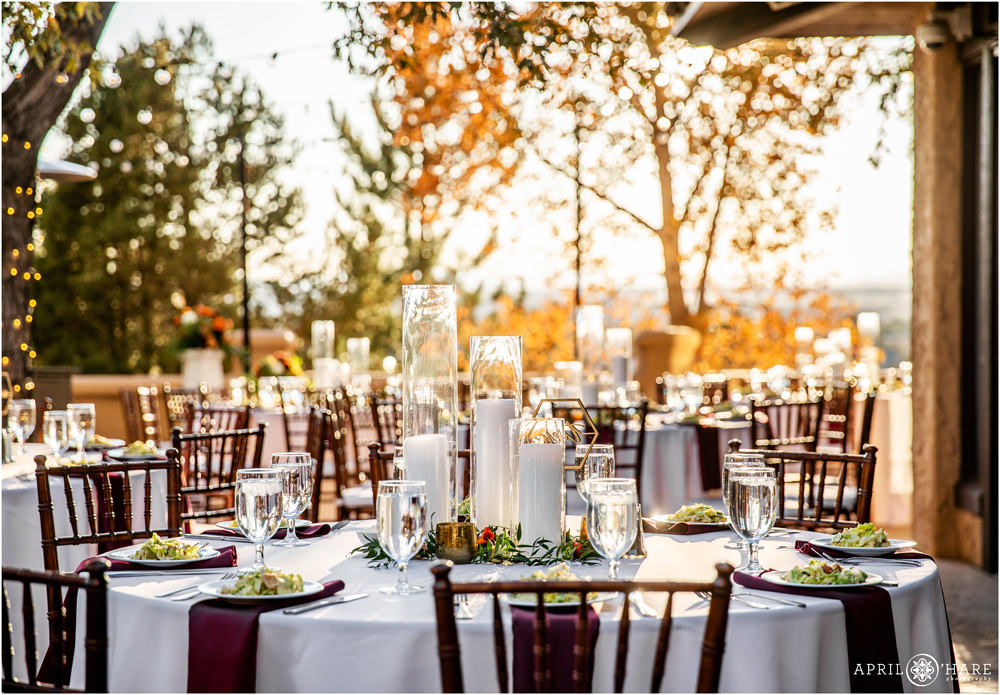 Colorado orange colored autumn wedding reception dinner table decor at Villa Parker