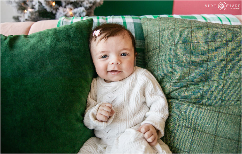 Adorable two month old baby girl at her family holiday photo session in Denver