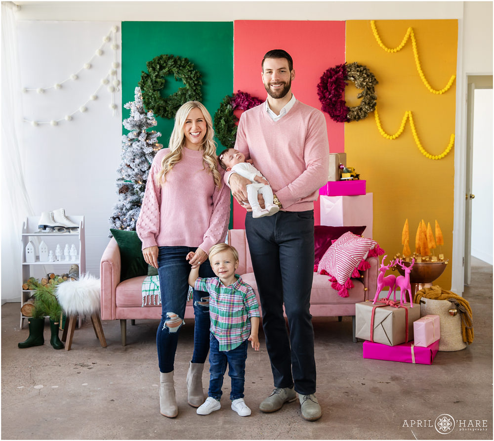 Adorable family pictures in a bold bright colorful holiday styled set in west Denver Colorado