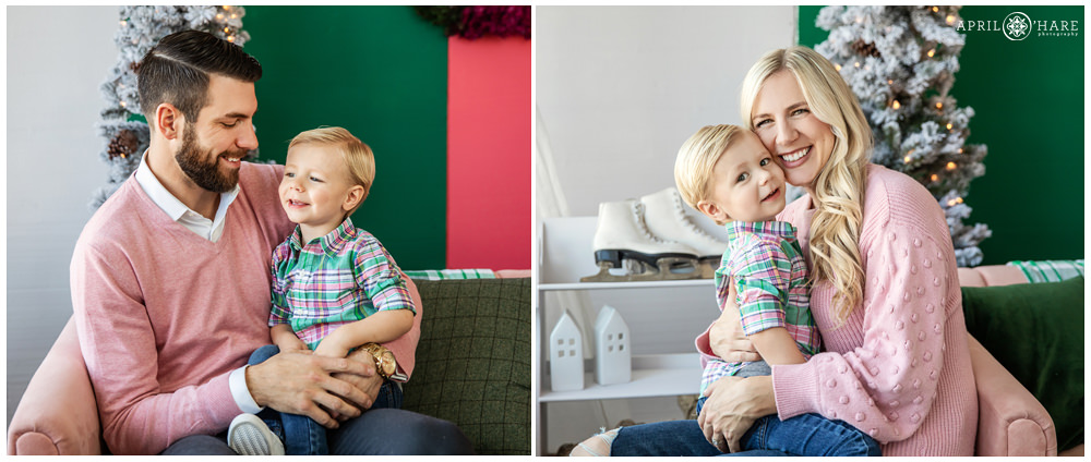 Sweet young blonde by poses with each of his parents at a holiday family portrait session in a natural light studio Denver