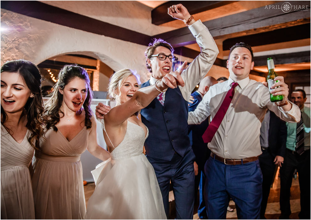 Bride and groom have fun on the dance floor with their besties at their fall wedding at Villa Parker in Colorado