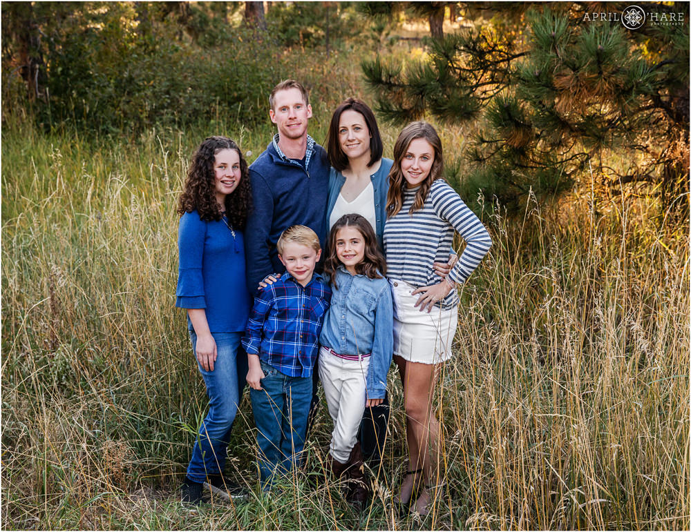 Sweet photo of a blended family in a forest setting at Fox Run Regional Park in Colorado Springs