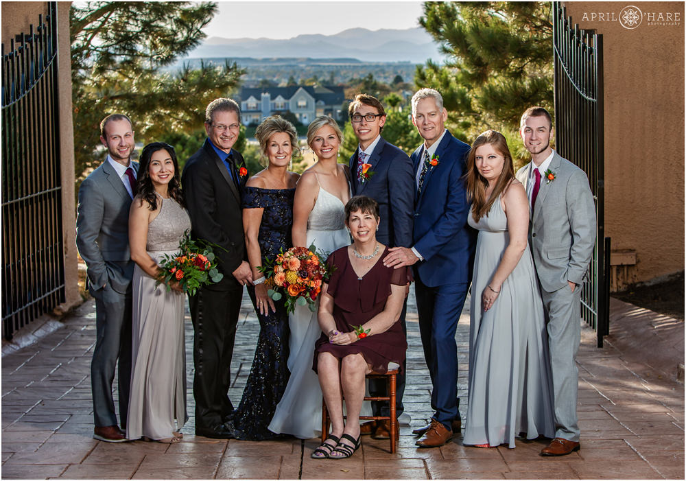 Family portrait with mountain backdrop at Villa Parker on an autumn wedding day in Colorado