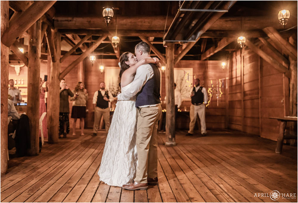 Romantic first dance photo from a rustic Vail wedding reception at Piney River Ranch