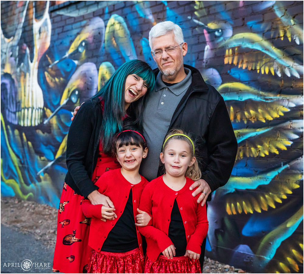 Family gives goofy faces for their family pictures in Rino area of North Denver Colorado