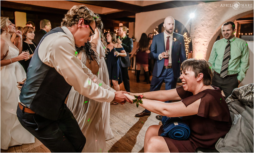 Groom and his mom laugh and dance on his wedding day at Villa Parker in Colorado