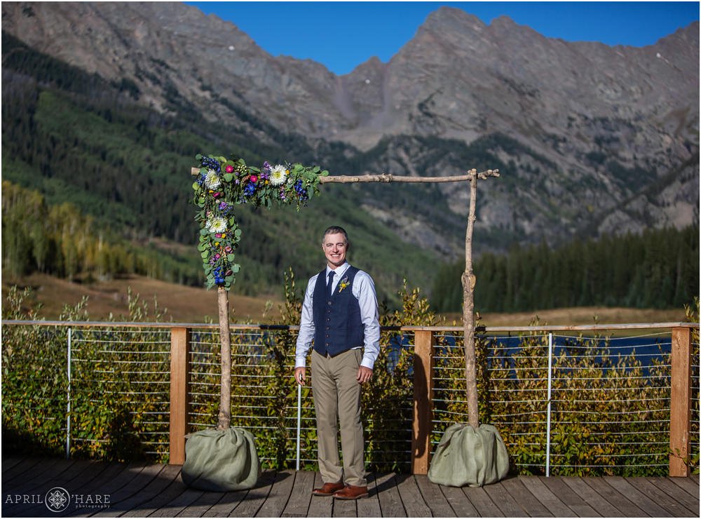Groom portrait with the pretty mountain view at Piney River Ranch in Colorado