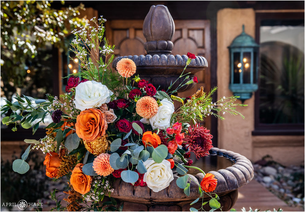 Close up detail photo of the orange flowers for an outdoor fall wedding at Villa Parker in CO