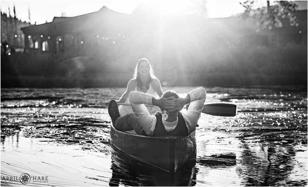 Romantic B&W Wedding photo of a bride and groom having fun in a canoe at Piney River Ranch in Colorado