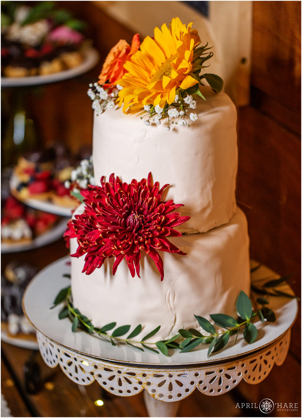 Cake by Christine Clancy for a fall wedding at the rustic wood cabin wedding venue in Vail