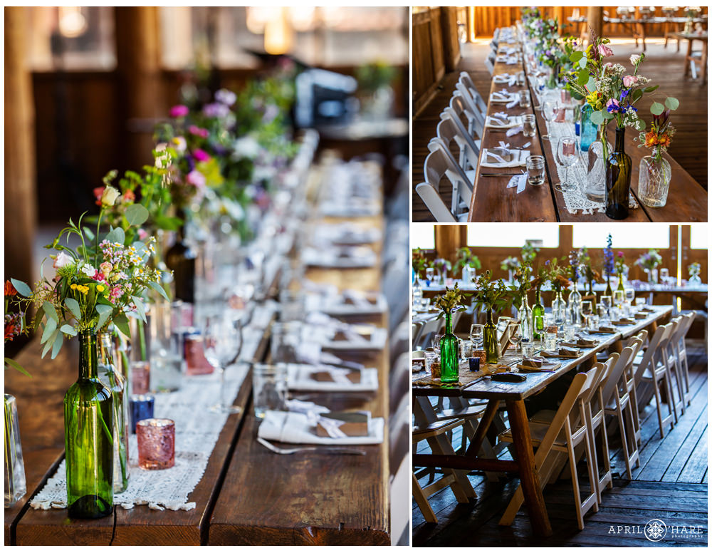 Rustic wood tables decorated with wildflowers and glass jars for a mountain wedding in Vail