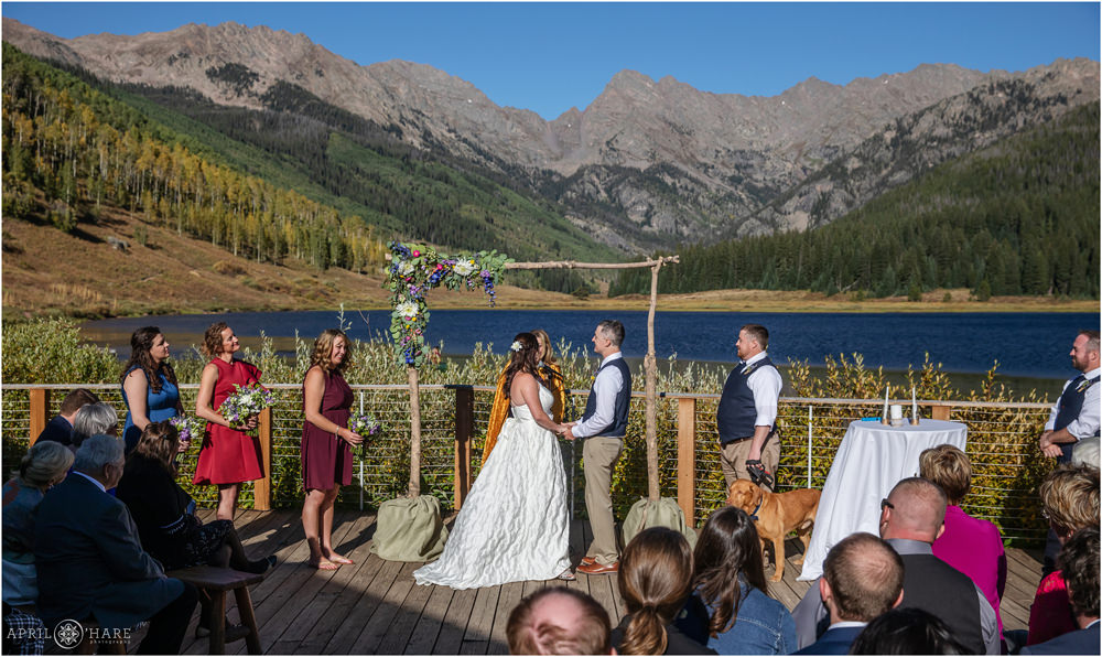 Wedding vows at an outdoor sunny day ceremony at Piney River Ranch