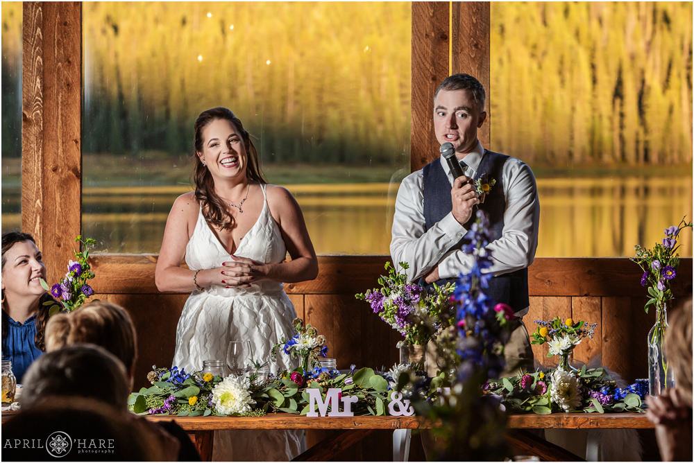 Bride and groom welcome their guests to dinner at their reception at Piney River Ranch in Colorado