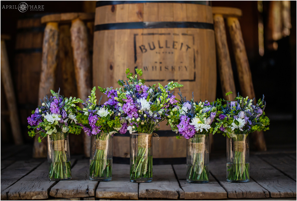 Pretty purple wedding bouquets at a rustic Vail wedding in Colorado by Fancy Pancy florist